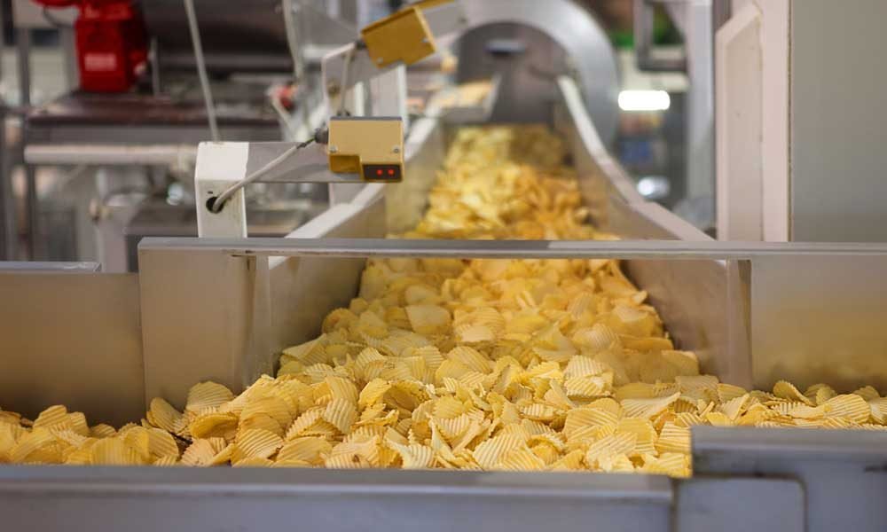 Packaged snack products on a production line.